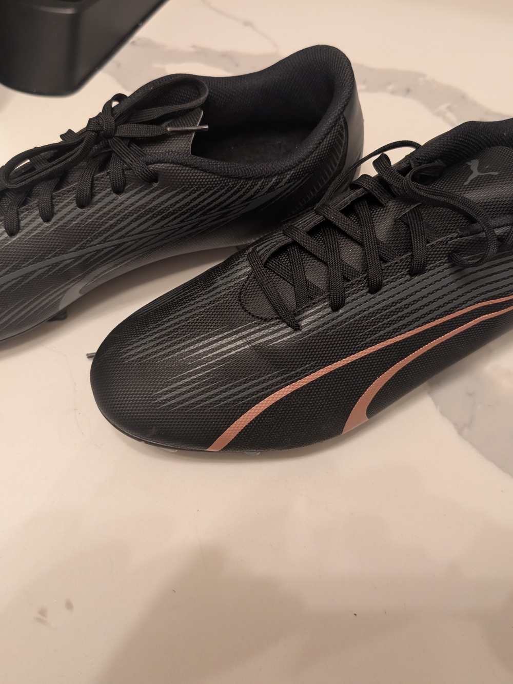 Puma Men’s Black Soccer Cleats with Rose-Gold Accents